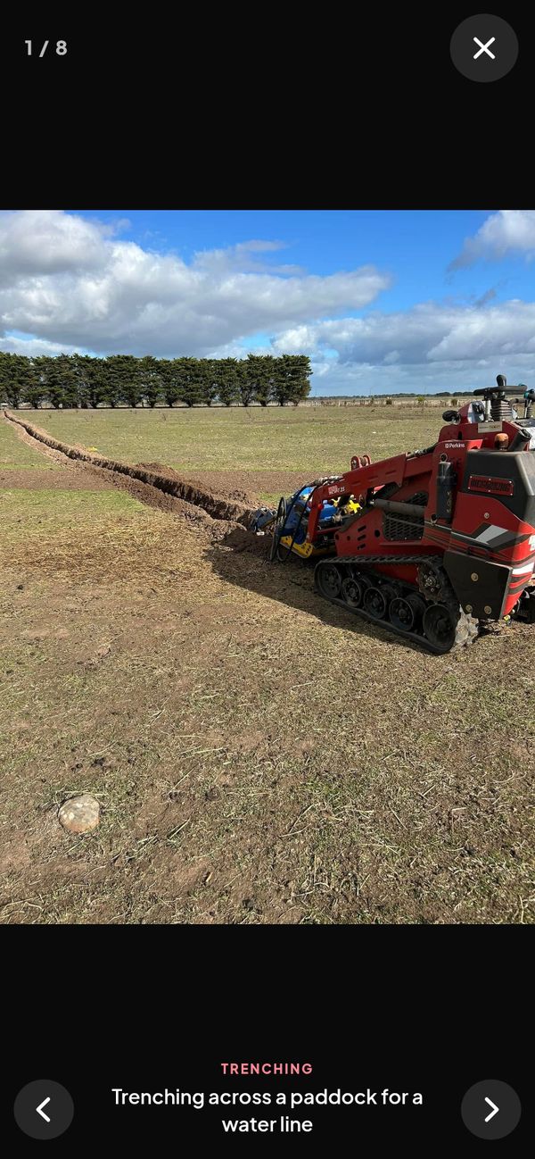 A gallery photo opened full screen on a phone, showing the mini loader trenching across a paddock, with a caption and next and previous arrows